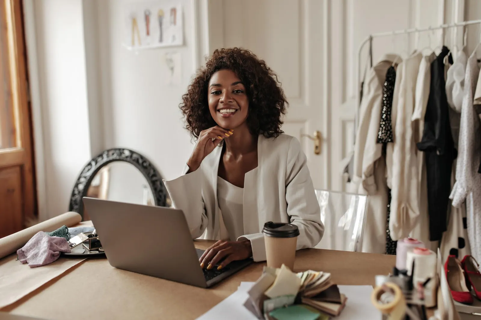 A business owner working at her laptop in her studio